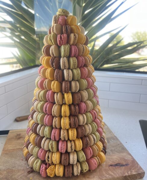 Macaron Tower with Macarons placed sideways. Using 289 Macarons with Pistachio, Raspberry, Chocolate, Vanilla, Lemon and Caramel as the flavours!